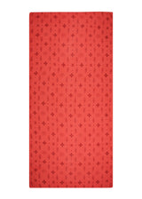 Dries quickly in the sun. The Strawberry Aura Sarong from The Bloom Set, coral red, shown flat.