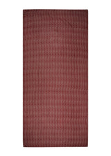 Light enough to pack for the beach. The Cacao Eye Sarong from The Forest Set, dusty red-brown, shown flat.