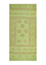 Sarong one day, picnic throw the next. The Matcha Om Sarong from The Citrus Set, apple green, spread out.