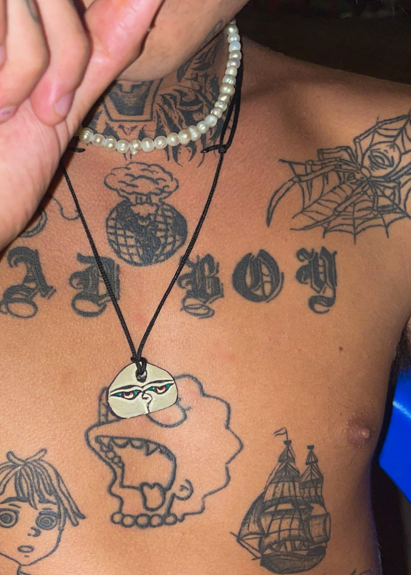 Hand carved Stone necklace - Buddha eyes